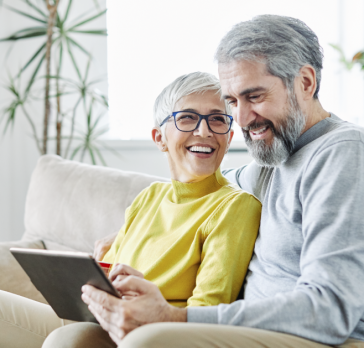 older couple on the couch researching electric providers in Ohio