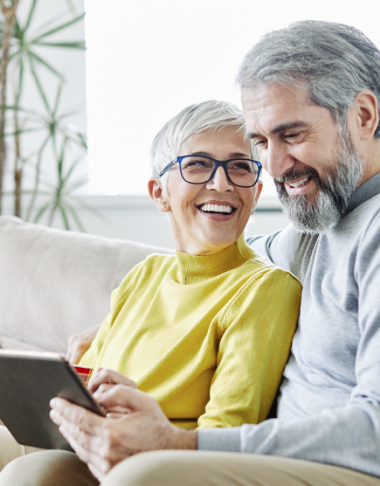 older couple on the couch researching electric providers in Ohio