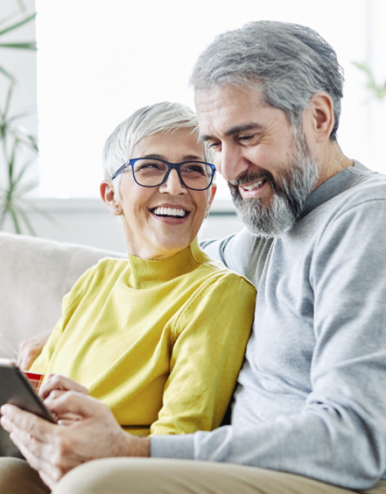 older couple on the couch researching electric providers in Ohio