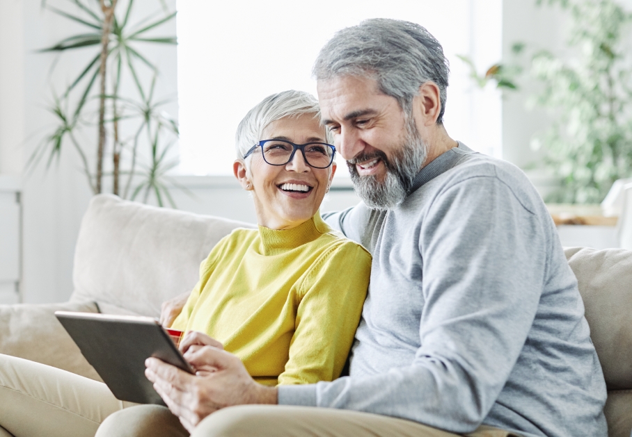 older couple on the couch researching electric providers in Ohio
