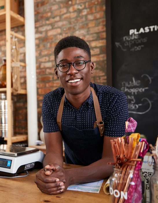 young man working at candy shop
