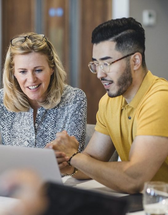 People looking at laptop
