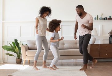 A family of 3 dance dance in their home in Cincinnati