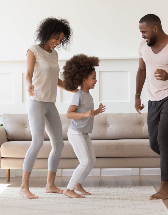 A family of 3 dance dance in their home in Cincinnati
