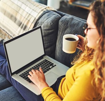 Woman on couch working