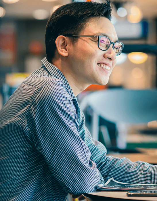 Man sitting at table smiling