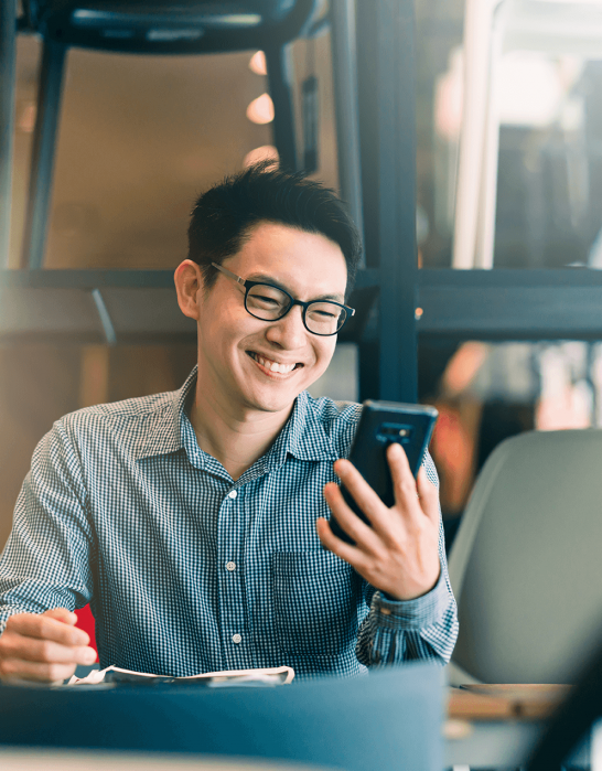 Man smiling at phone