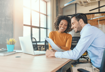 Woman and man looking at papers
