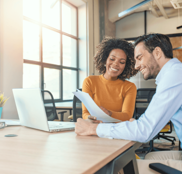 Woman and man looking at papers