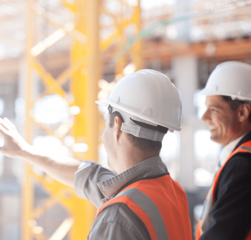 Men at construction site talking