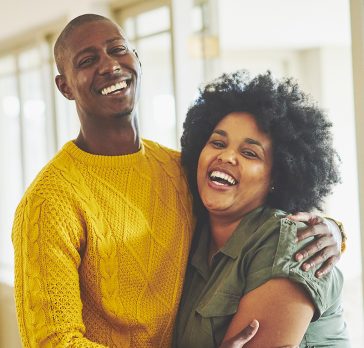 Couple hugging and smiling