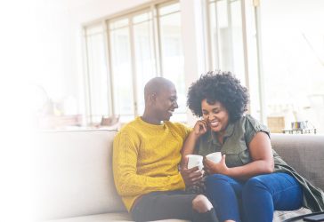 Couple smiling having coffee