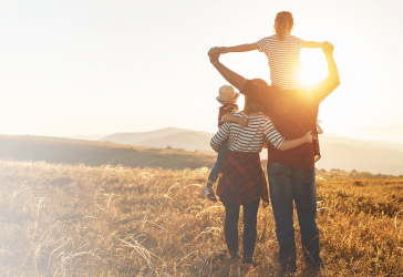 Family looking into sunset