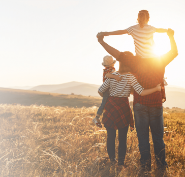 Family looking into sunset