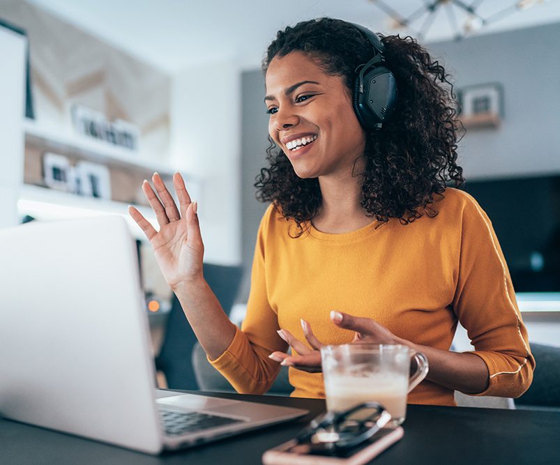 Young modern woman having Video Conference at home