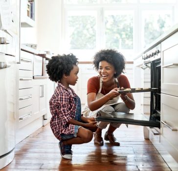 Shot of a mother and son baking together in the kitchen