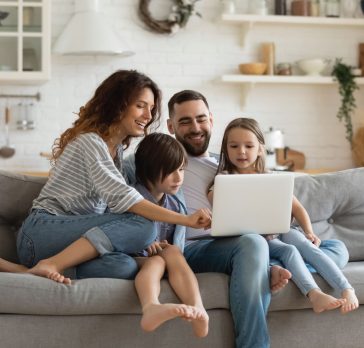 Family siting on couch