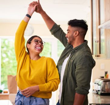 Couple dancing in kitchen