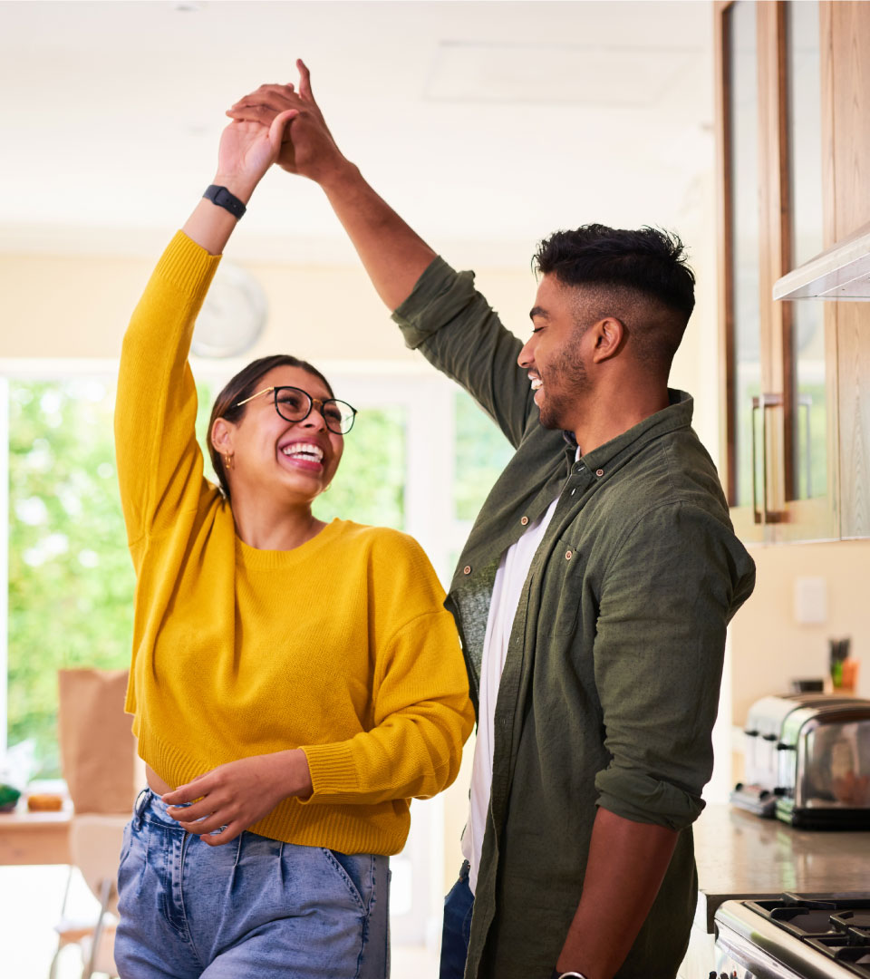 Couple dancing in kitchen
