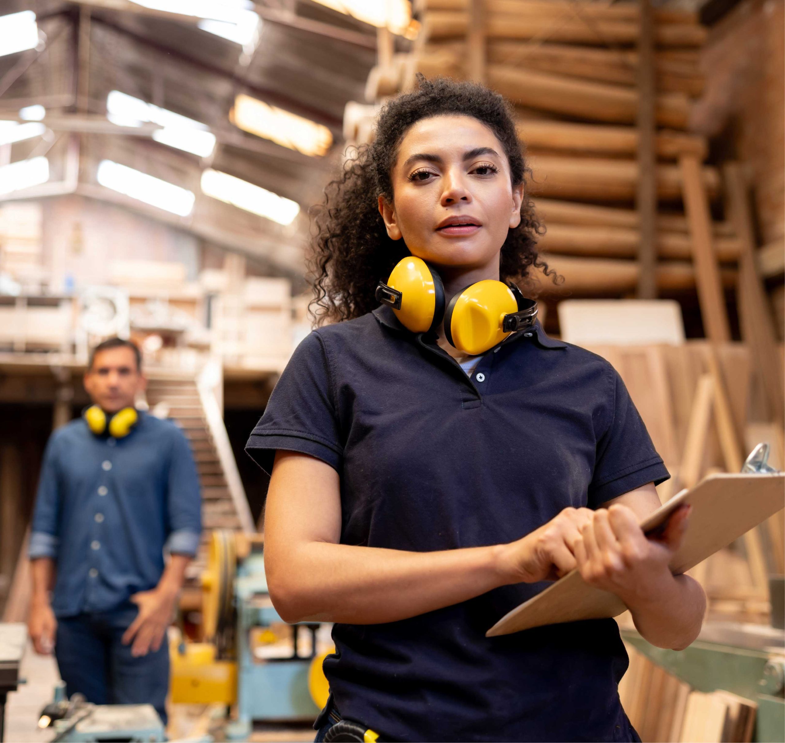 Lady holding clip board in warehouse