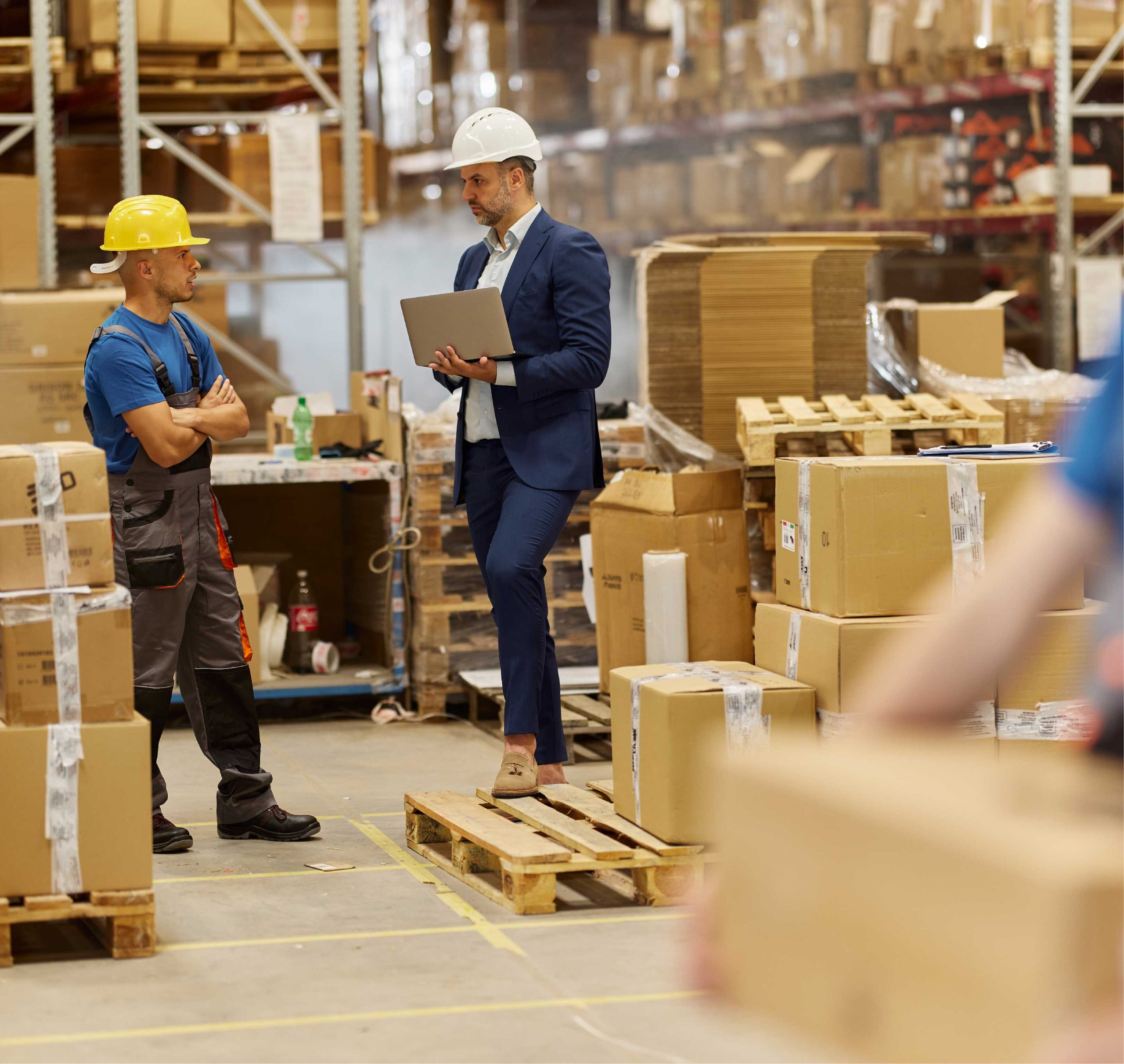 Conversation between two men in warehouse