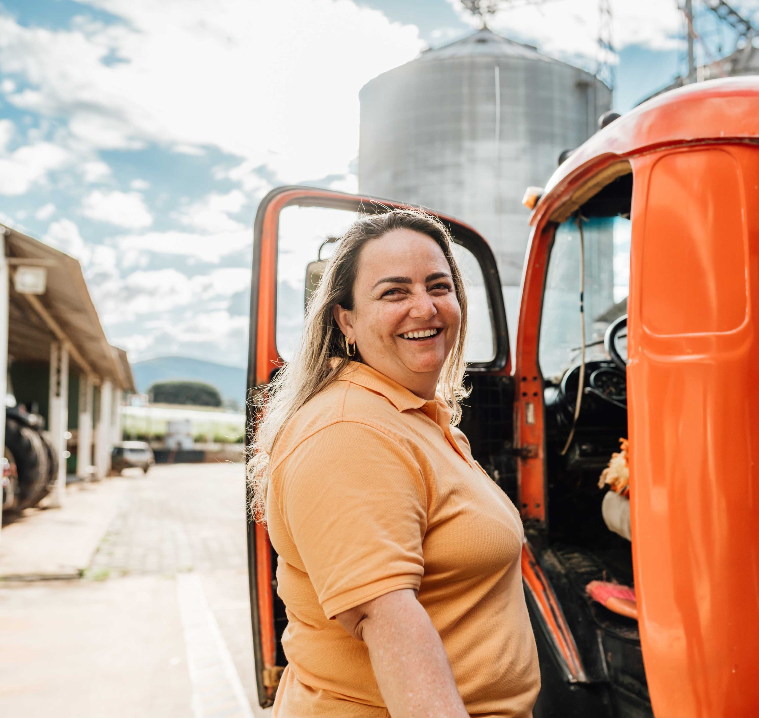 Lady standing in front of truck door