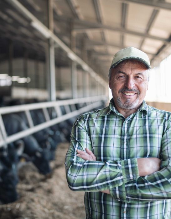 Man Smiling in a Barn