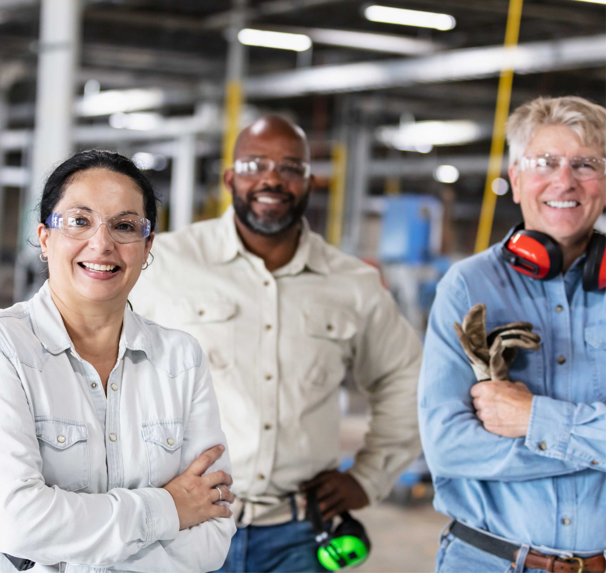 Group of factory workers looking at camera