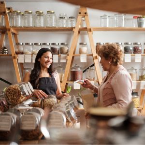 Two ladies talking in small market
